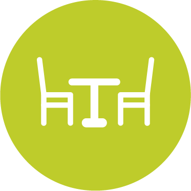 Icon mit einem Tisch und zwei Stühlen für Gastronomie und Handel.